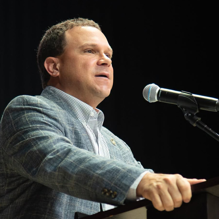 Man speaking at podium